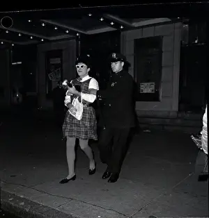 Cross Dresser Prints: Man Dressed As Woman Led Off By Policema