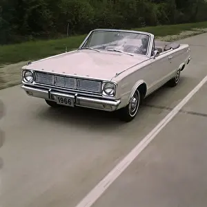 Man Driving 1966 Dodge Dart GT Convertible