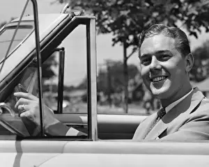 Grainy Prints: Man driving convertible