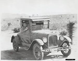 Worry Prints: Man Driving Mud-Splattered Car