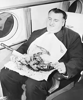 Passenger Prints: Man Eating Turkey on Airplane