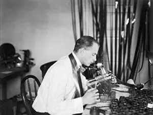 Machine Prints: Man Editing Film; Editing Machine