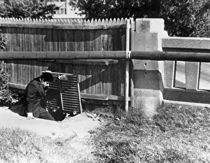 Investigating Prints: Man Enters Sewer from Grassy Knoll
