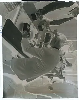 Man Examining Chicken-Wrapper
