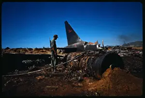 Da Nang Prints: Man Examining Crash Site