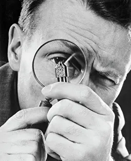 Man Examining a Diamond Pointed Tool