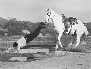 Man Falling From Horse