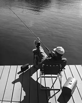 Man fishing from dock
