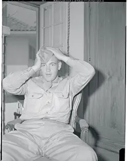 Man Fixing His Hat