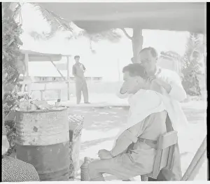 Man Getting Haircut at Encampment