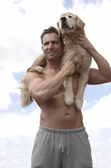 Carrying Prints: Man with Golden Retriever on his shoulder