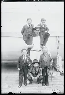 Man with Group of Little People