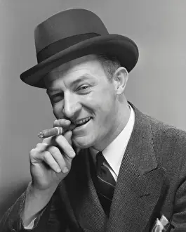 Man in hat smoking cigar