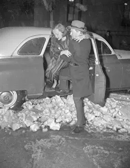 Man Helping Tallulah Bankhead Out of an Automobile