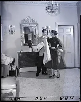 Debutante Prints: Man Helps Woman On With Coat