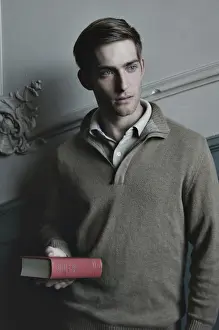 Reflective Prints: Man holding a book in the stairwell, nostalgic portrait