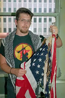 Burned Prints: Man Holding Burned American Flag