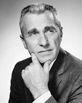 Gray Hair Prints: Man holding chin and looking upward
