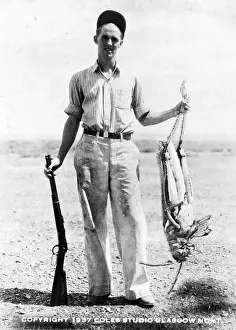 Huge Prints: Man Holding Giant Grasshopper