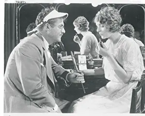 Man Holding Mirror For Actress