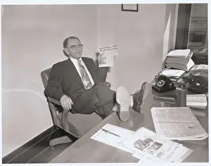 Man Holding News Clipping