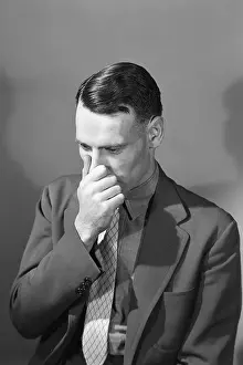 Nose Prints: Man Holding Nose