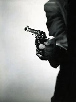 Soft Gallery: Man holding pistol