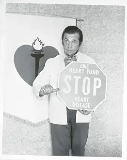 Man Holding Stop Sign