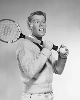 Tennis Prints: Man holding tennis racket over his shoulder