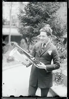 Man Holding a Violin