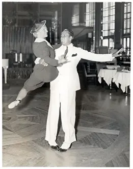 Man Holding Woman in Air