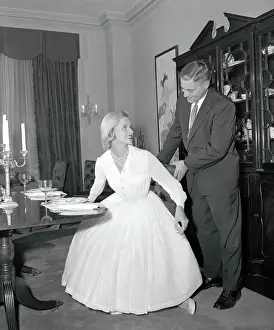 Man Holding a Woman's Chair