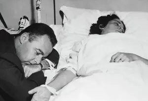 Exhausted Prints: Man at Hospitalized Wife's Bedside