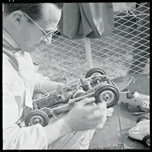 Monza Prints: Man Inspecting Miniature Car