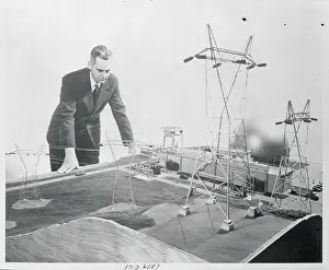 Man Inspecting Model Atomic Plant