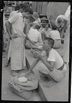 Yangon Prints: Man Inspecting Rice in Market