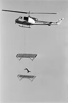 Daredevil Prints: Man Jumps On Trampoline Hanging From Hel