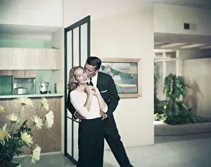 Casual Collection: Man kissing woman, smiling