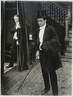 Man Laughing at Gentleman in Top Hat