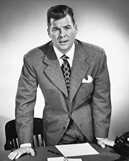 Formal Businesswear Prints: Man leaning on desk