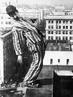 Down Prints: Man On Ledge Of Roof, Movie Still