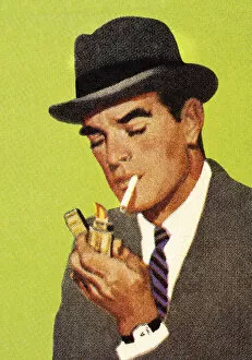 Images Dated 26th March 2014: Man Lighting a Cigarette