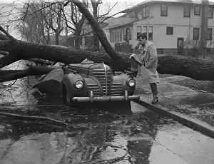 Man Looking at His Damaged Car