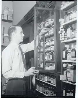 Harrisburg Prints: Man Looking Through Drug Cabinet