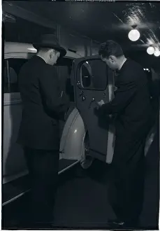 Buying Prints: Man Looking at Interior of Car
