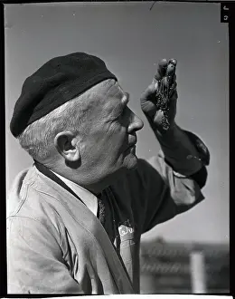 Oceanside Prints: Man Looking at Worms