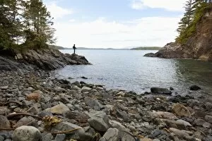 Images Dated 19th January 2012: A Man Looks From A Cove Along The Lighthouse Trail