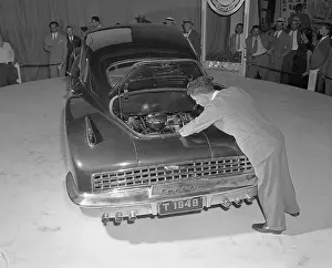Man Looks at Engine in Tucker Car