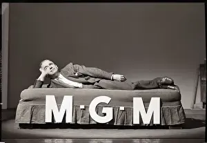 Man Lying on M-G-M Bed