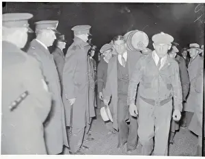 Man Marching with Barrel on Back